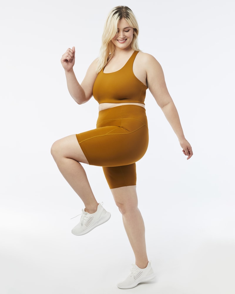 Plus size model with hourglass body shape wearing Xiomara High-Rise Bike Shorts by Girlfriend Collective | Dia&Co | dia_product_style_image_id:157478